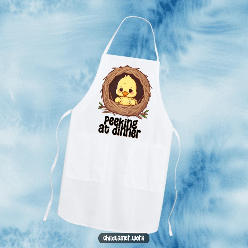 Funny duckling peeking from a nest on a kitchen apron, cute and humorous cooking accessory.